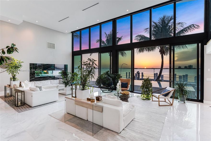 Welcome to an extraordinary waterfront retreat in the heart of gated community Biscayne Point Island, where stunning western bay views set the stage for a life of luxury. Originally designed by renowned architect Barry Sugerman, this designer residence seamlessly blends modern waterfront living with a car enthusiasts' vision and boaters' paradise. Featuring 98 feet of water frontage, this 5-bedroom, 6.5-bath residence is a sanctuary for cars and boat lovers including those who appreciate breathtaking sunsets. Thoughtfully crafted with sophistication and comfort in mind, the home exudes elegance and timeless charm. Whether hosting, entertaining guests or enjoying peaceful moments by the water, every detail has been carefully curated to provide the ultimate
living experience.