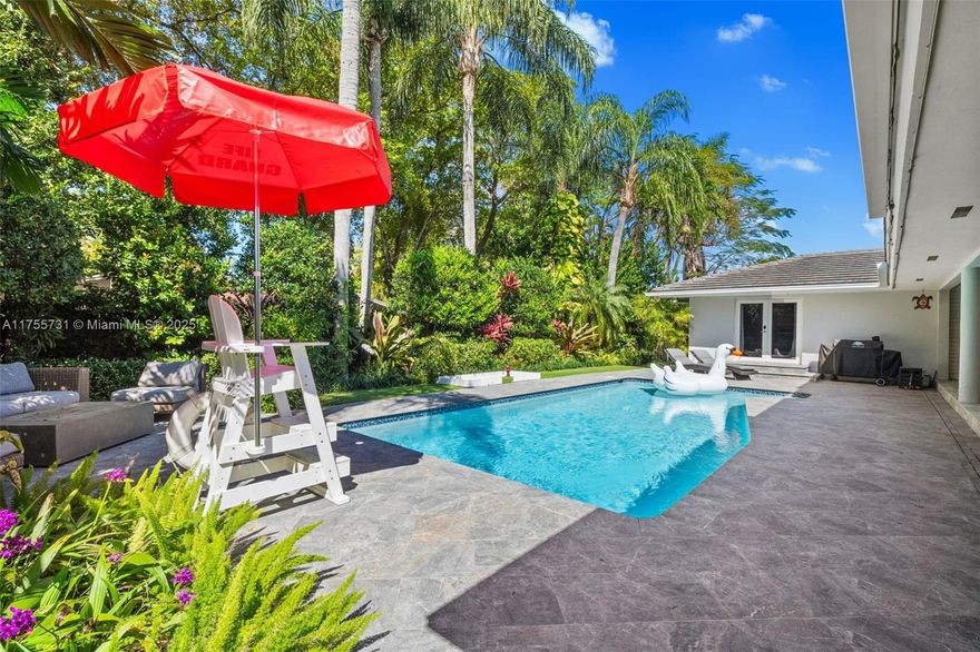 Beautiful South Miami Estate on a serene and private cul-de-sac. Like a scene from a movie, this dream home awaits! If you love plants, you will enjoy the butterfly garden and all the exotic plants that were planted with much love and attention to detail. Sunlit living spaces invite you in, while the main suite is a private retreat with a spa bath. Outside is your personal oasis—a sparkling pool, covered patio, and entertainment space designed for unforgettable moments. Built for any occasion, it has a generator, pool heater, new roof with double straps, impact windows, gas tanks, exceptional landscaping, and a decked-out garage. The back gate leads to an alley straight to Gulliver. Enjoy top-tier schools, luxury shopping, and fine dining close by. A Beautiful Miami Home! Make it Rein!