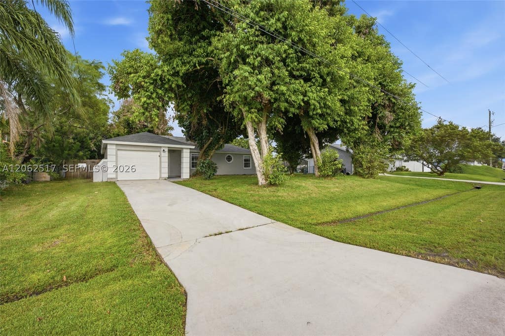 Photo of 1617 SW Hampshire Ln, Port St Lucie, FL 34953 (MLS # A12062517)