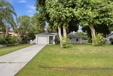 Photo of 1617 SW Hampshire Ln, Port St Lucie, FL 34953 (MLS # A12062517)