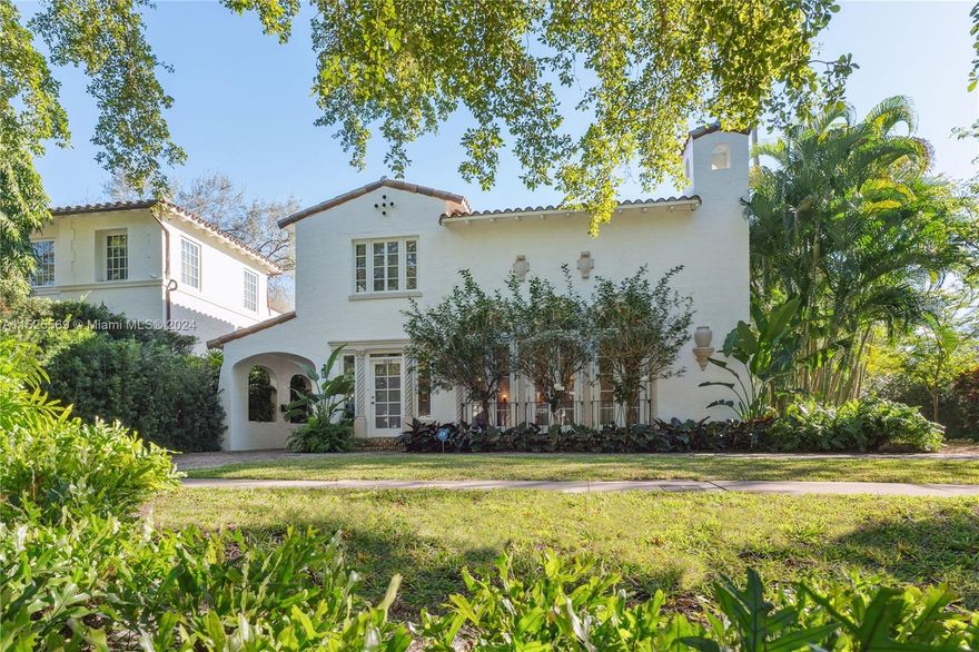 Embrace this exclusive Coral Gables gem, a majestic home designed by George Fink & meticulously renovated. With impact windows & doors, & a 1-year-old roof, this residence is move-in ready. As you enter, abundant natural light, 22Ft vaulted ceilings, & beautiful French doors greet you, leading to a spacious kitchen & breakfast room overlooking the lush garden & inviting pool. The main house features a fireplace, large family room, formal dining room, & stunning tile & wood floors. Walk up the grand staircase to 3 generous bedrooms with a primary bdr open balcony. A second cottage behind the main house is fully renovated with its own kitchen, bedroom, office, bathroom, outdoor shower, & 2 car garage. Close to Salvadore Park, ideal for Pickleball & Tennis enthusiasts, & Biltmore golf course.