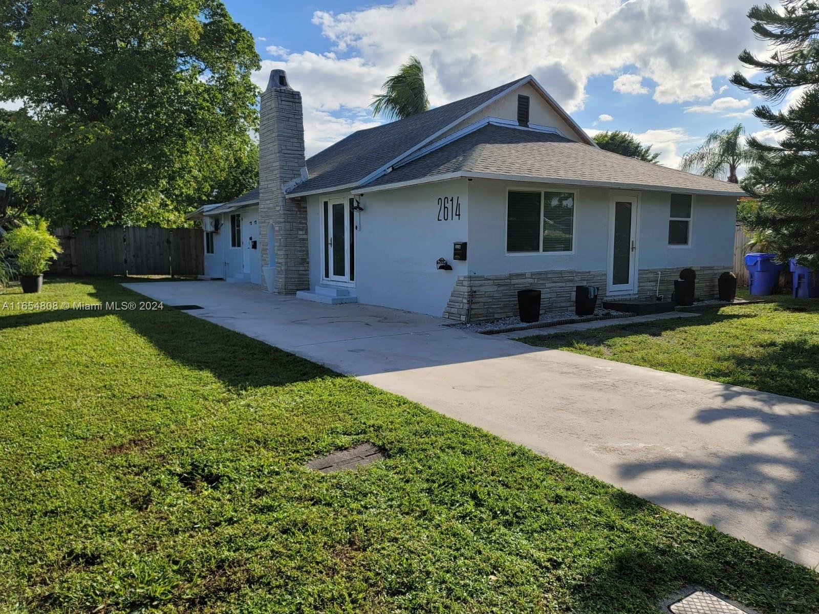 Beautiful renovated home with a huge 8,000+ SF backyard. This house is divided into 2 units. The 2 beds and 2 baths rented for $3,000 and 1 bed and 1 bath rented for $2,000 per month. Excellent investment opportunity, both units are rented with an annual contract. Each unit has a private backyard with deck. This home features, impact windows, impact doors, new roof 2023, new exterior paint. No HOA!! Located in the heart of Hollywood, close to downtown Hollywood, 4 miles from the beach, 10 minutes from Fort Lauderdale Airport. Easy to show!!