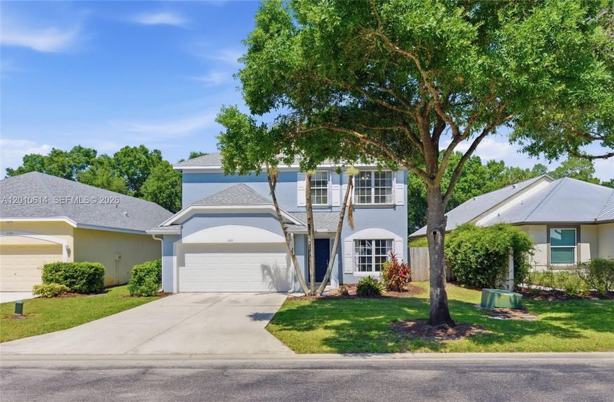 Spacious 4BR/2.5BA home backing to preserve in desirable gated community of Palm Isles. NEW ROOF & NEW IMPACT GARAGE DOOR! Enjoy added privacy with tranquil preserve views from the backyard. This well-maintained residence features an eat-in kitchen with wood cabinetry and newer stainless steel appliances. Porcelain tile on main level and new laminate on second floor. The layout offers generously sized bedrooms, including an oversized second bedroom, along with a spacious primary suite featuring a large walk-in closet and well-appointed bath. Additional highlights include a second-floor laundry room, covered and screened patio ideal for outdoor living, and hurricane protection with accordion shutters on the second floor and panels on the first.  5 minutes to I-95 or the turnpike, 12 minutes to downtown Stuart, and 20 minutes to the beach. A-Rated schools zone!