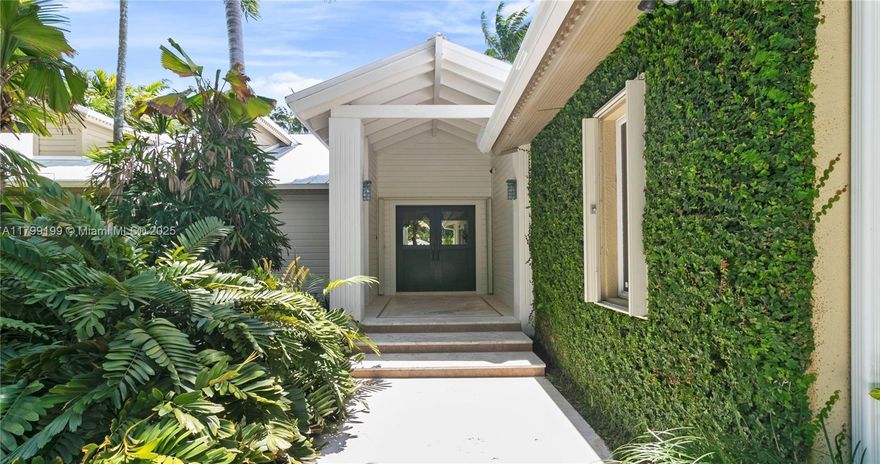 There might be others, but nothing quite like this. Hidden behind a thoughtfully designed landscape lies an exceptional Key West-style home created with entertaining in mind. A picturesque foyer opens to a stunning great room that seamlessly combines living, dining, and a chef's kitchen with Wolf/Sub-Zero appliances and quartzite countertops. The expansive primary suite offers a spa-like retreat, while the secondary bedrooms are thoughfully set apart to maximize privacy. Outside, enjoy a sun-drenched patio, sparkling pool, full house generator and a freshly resurfaced tennis court. A rare blend of comfort, style, and indoor-outdoor living.