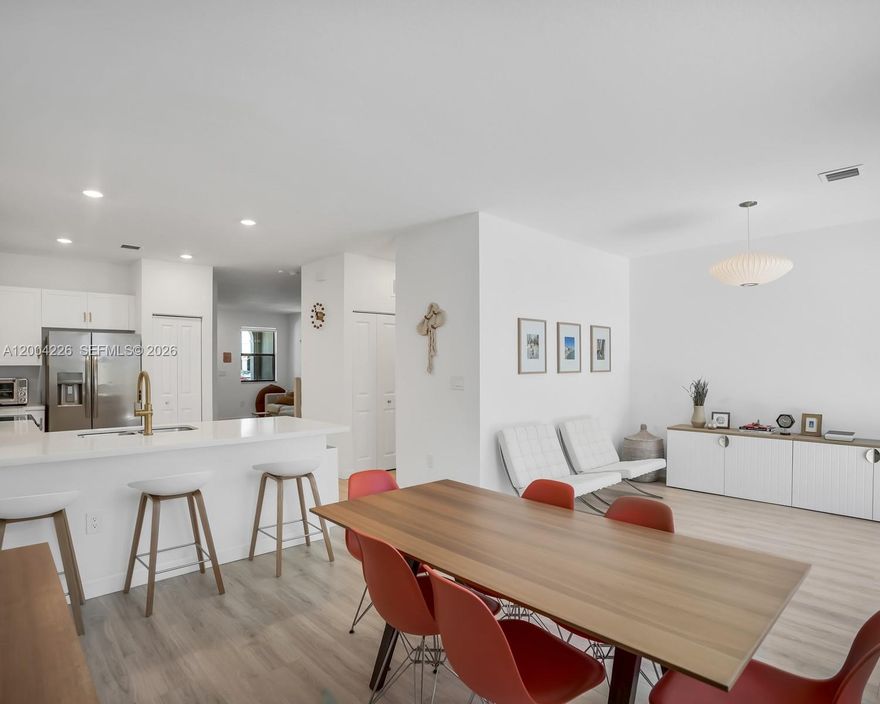 Beautifully maintained newer construction townhome in the gated community of Pine Vista. Largest model available, offering 4 bedrooms and 2.5 baths. The main level features an open-concept layout with a modern kitchen showcasing contemporary cabinetry, stainless steel appliances, and ample counter space—ideal for everyday living and entertaining. Enjoy a fenced backyard perfect for gatherings, plus a 1-car garage for parking or extra storage. Resort-style amenities include a pool, clubhouse, gym, playground, and guest parking. Conveniently located near shopping, dining, Homestead Air Reserve Base, and the Florida Turnpike.