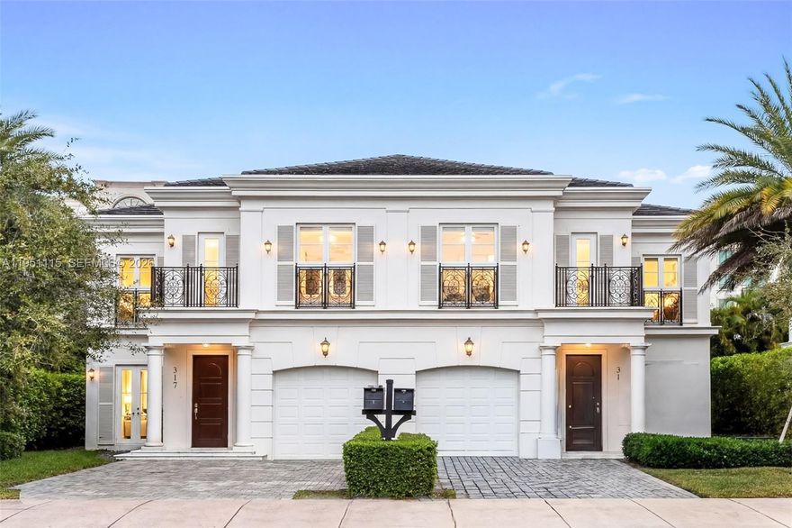 Located in the heart of Coral Gables, this stunning 2-story luxury townhouse in Villa Blanc offers 2,560 SF under air with 3 bedrooms, 3 full bathrooms, and 1 half bath, just steps from The Plaza, Miracle Mile, and Giralda’s premier dining and shopping. The elegant interior showcases high-volume ceilings, marble floors, wide plank baseboards, recessed lighting, French doors and windows, and an ample entry foyer with a solid wood door. The open-concept great room seamlessly connects living and dining spaces to a gourmet kitchen featuring white quartz countertops, a center island with seating, and premium Thermador appliances. Upstairs offers three bedrooms, a den or office, wood-style tile flooring, and a full laundry room. Outdoors, enjoy a private chlorinated lap pool with Venetian Grey marble deck, ironwork balconies, and a 1-car garage with storm-rated door. The expansive primary suite features two walk-in closets, spa-style bath with frameless marble shower, Roman tub, dual vanities, and private balconies overlooking the pool and entrance. Additional features include dual AC units (2019), ADT security system, and hybrid electric water heater.