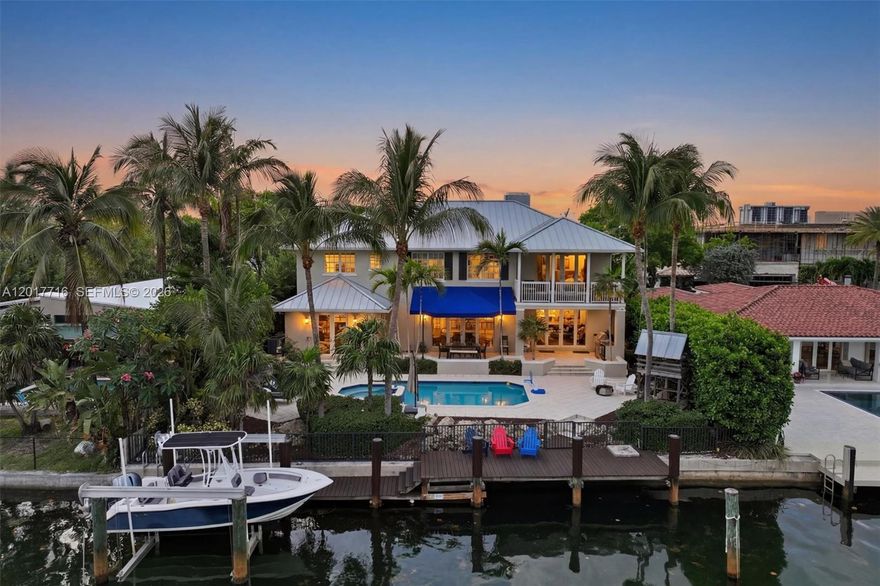 Welcome to Keystone Bay Vista, a stunning Caribbean Contemporary waterfront residence in the heart of Keystone Point, blending timeless coastal design with elevated luxury living. Ideally positioned just a few homes from the open bay, this exceptional property offers easy Biscayne Bay and ocean access with a private boat lift—perfect for embracing Miami’s elite waterfront lifestyle.

Featuring a metal roof, hurricane impact windows and doors, rich mahogany wood flooring throughout and soaring vaulted ceilings create an airy, light-filled atmosphere.

The chef’s kitchen is equipped with natural gas, premium appliances, and an oversized center island perfect for entertaining. The grand primary suite is a true retreat with an oversized walk-in closet with dressing island, spa-inspired marble bath with dual vanities, and a large private balcony showcasing breathtaking sunset and bay views.

Outdoors, enjoy a resort-style saltwater heated pool surrounded by swaying coconut palms, creating the ultimate tropical waterfront setting. A mature Florida avocado tree welcomes you at the front of the property, adding to the home’s lush South Florida charm.

Enjoy seamless indoor-outdoor living with tranquil waterfront surroundings, tropical breezes, and the relaxed elegance of a Florida Keys-inspired lifestyle. A rare offering for the quality-minded buyer seeking luxury, craftsmanship, and premier waterfront living in one of Miami’s most desirable gated communities.