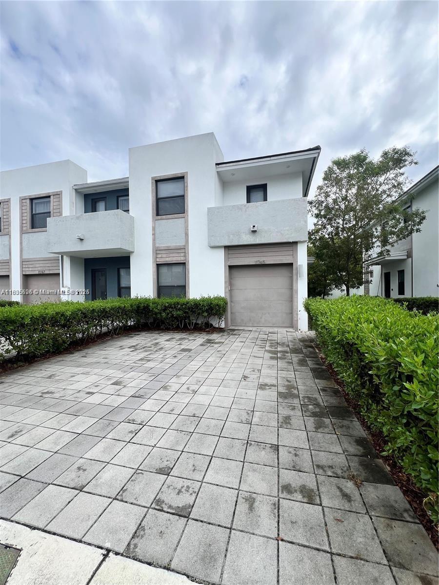Experience this FULLY FURNISHED home that has been meticulously cared for since new! Only one person has lived in this unit since purchased. It offers incredible comfort mixed with the ultimate sense of modernism. Precisely placed at walking distance to local shopping centers, restaurants, parks and schools all within less than a mile. The private backyard patio offers a perfect setting for relaxing and entertaining guests with its own private entrance. Tropical landscaping and decorative street lighting throughout the entire community. Gated community with a full surveillance system for added security. No pets of any kind. Call to see !! Not available until AUG 1st.