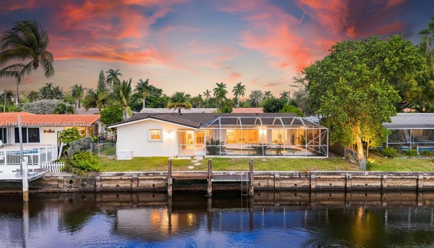 New updated price! Your Paradise awaits!! Over 80K in updates. A boater’s dream with deep water access right from your backyard. This 3 BD 3 BA waterfront gem sits in a quiet end-of-the-street location in Coral Ridge Isles neighborhood, priced BELOW market value & loaded with rare features. Enjoy 75 ft of seawall, a 22 ft dock with a 7-8 ft bridge clearance straight to the ocean! Plus a screened-in pool for bug-free relaxing & entertaining. Home features all updated baths, polished terrazzo floors, outdoor sitting area, new central AC (2023), custom kitchen, accordion shutters, & newer roof just painted. A natural gas Generac generator ($15K), new electrical, 2 car garage, & WORKING sprinkler system. South exposure offers beautiful sunrises & sunsets over the canal with ocean access! Vacant, easy to show.