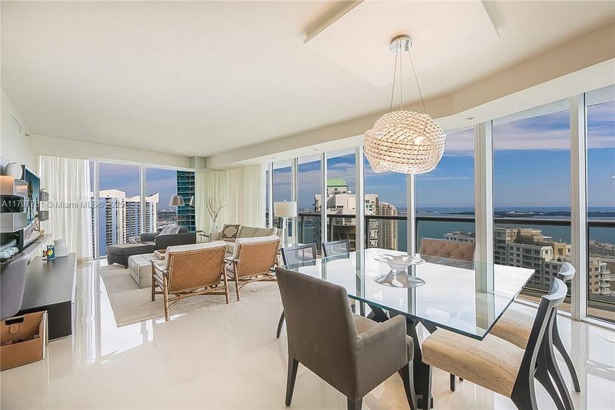 Experience the pinnacle of luxury, breathtaking, unobstructed bay and ocean views that showcase the best of Brickell. This stunning residence is decorated with custom finishes, exuding elegance from the moment you step inside.   The primary suite boasts floor-to-ceiling doors open to an oversized balcony with panoramic bay views. Enjoy the luxury of double walk-in closets with custom-built-ins, a lavish bathroom with a separate tub, shower, bidet, and double sinks.  The secondary bedrooms offer a private suite with amazing views, and a full bathroom. The European gourmet kitchen shines with stainless steel appliances and ample storage.  Icon offers a resort-style variety of amenities. In the heart of Brickell, steps away from parks, restaurants, shopping, short drive to beaches, and more.