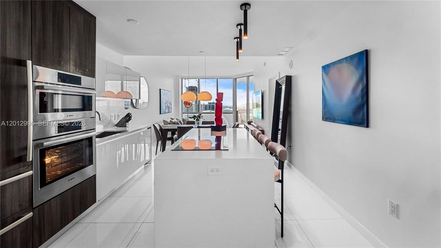 Highly functional 1BD residence that lives as a 2BD/2BA at Paramount Miami Worldcenter. This thoughtfully designed unit features an Florida bedroom with closet and ensuite bath, offering flexibility and privacy. The open-concept layout showcases modern finishes, in-unit washer and dryer, and automatic blackout shades throughout. Enjoy a private balcony with city and partial bay views.

Includes assigned parking plus valet option for a second vehicle. Residents enjoy 6 acres of resort-style amenities, including multiple pools, state-of-the-art fitness center, spa, sports courts, rooftop pool, theater, and more.

Owner would consider selling fully furnished (negotiable) with designer furniture from Lazzoni.