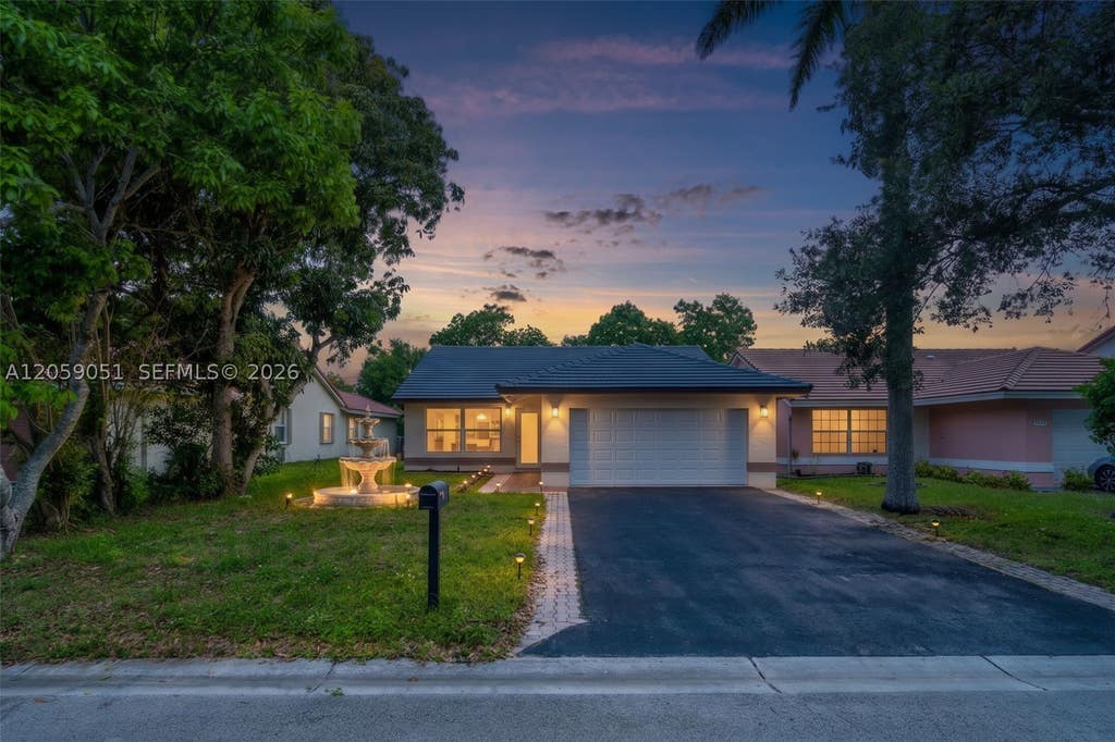 Photo of 2828 NW 95th Ave, Coral Springs, FL 33065 (MLS # A12059051)