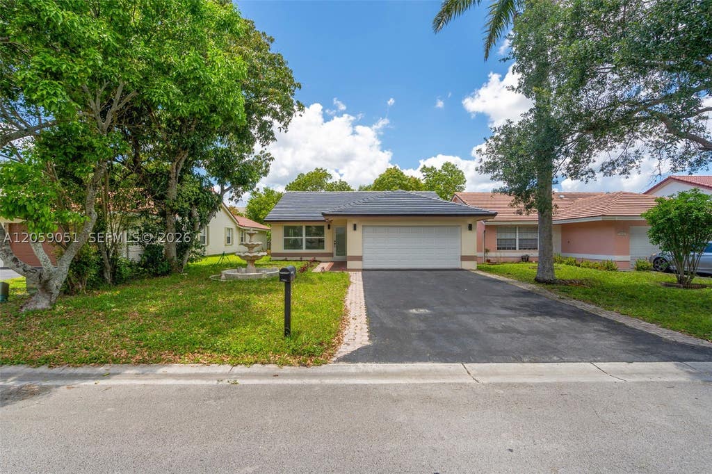 Photo of 2828 NW 95th Ave, Coral Springs, FL 33065 (MLS # A12059051)