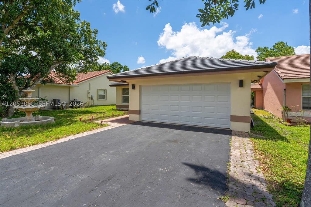 Photo of 2828 NW 95th Ave, Coral Springs, FL 33065 (MLS # A12059051)