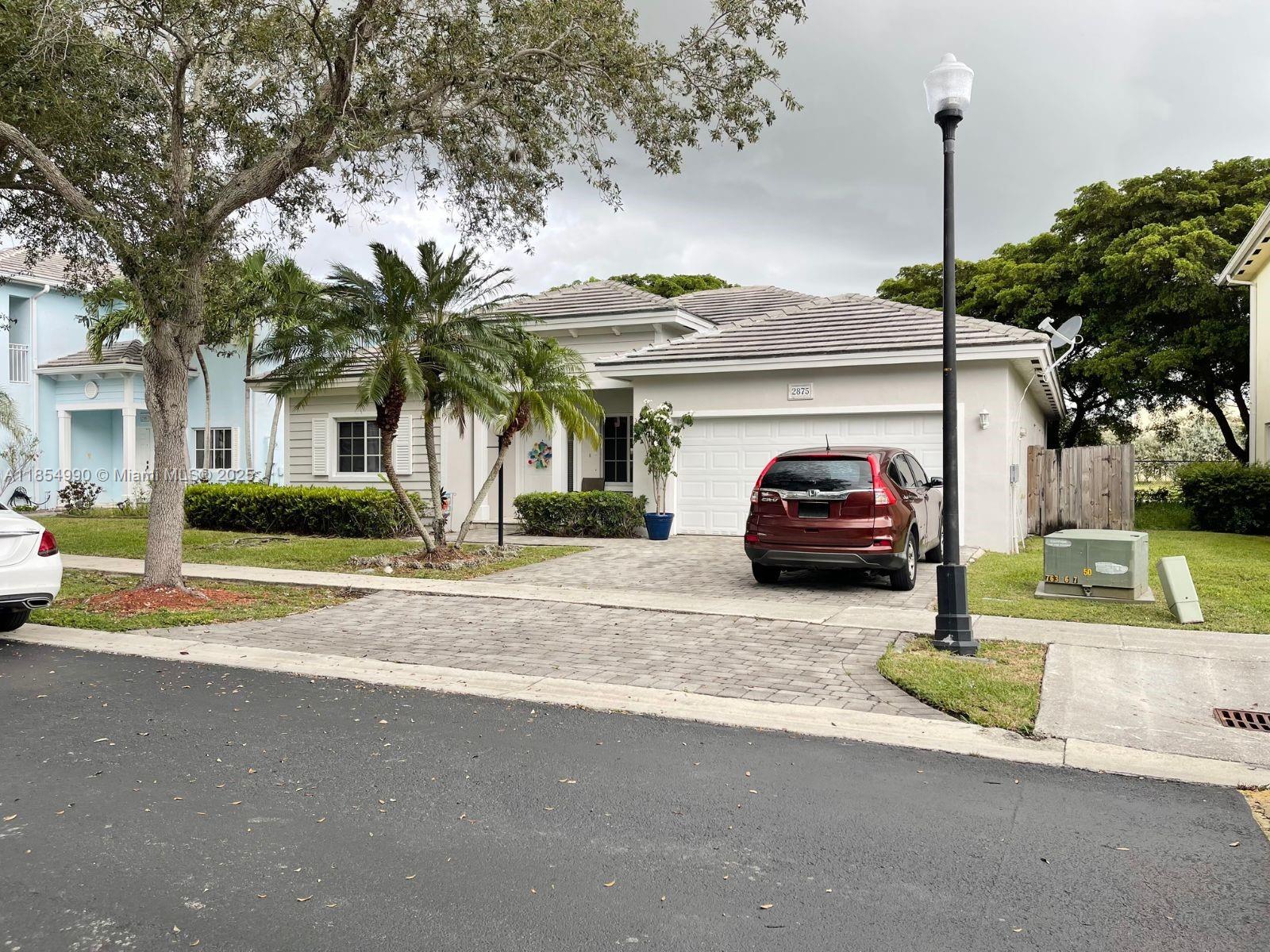 Discover this spacious 4-bedroom, 3-bathroom single-family home in a desirable gated community in Homestead, Florida. With 1,889 sq ft of living space all on one level, this home features a formal dining room, generous living area, and a dedicated laundry room. Enjoy peaceful canal views from your private backyard. The home also includes an attached garage and access to community amenities such as a pool, exercise room, and low HOA fees. A perfect blend of comfort, convenience, and lifestyle.