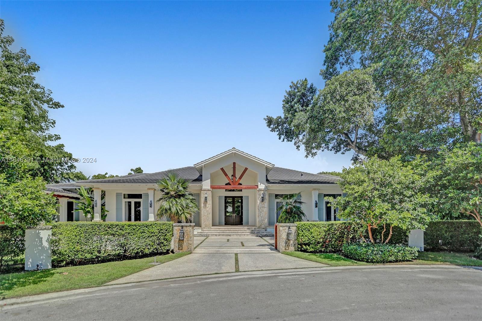 Welcome to this exquisite home, where elegance meets comfort. Step onto marble floors and be greeted by a grand foyer with soaring ceilings, flowing seamlessly into an open floor plan where the family room offers serene views of the pool. The gourmet kitchen features custom cabinetry, top-of-the-line appliances, and a spacious pantry. The master suite is a true retreat, complete with a cozy sitting area, his-and-hers closets, a bathtub, and a breathtaking outdoor shower. Enjoy the expansive covered terraces, a gazebo with a summer kitchen, and a pool adorned with four fire bowls. Additional amenities include a billiard room, an office, and a laundry room. This exquisite residence is ready to be yours.