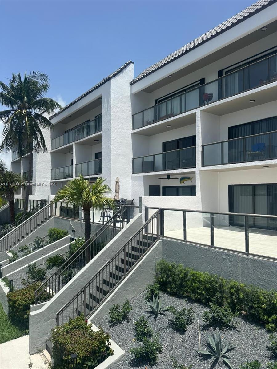 24/7 guard gated community of Eastern Shores. Overlooking the Intracoastal Waterway, Beautiful residence gated and comes with 2 bedrooms, 2 ½ baths, 2 covered parking spaces. Additional features include marvel floors stainless rust proof appliances, washer & dryer in unit, large patio and open balcony with direct water views. Great community with billiard room, swimming pool, sauna, exercise room and plenty of guest parking. Located within minutes from shopping mall, top rated schools, I-Pic Theater, fine dining, Sunny Isles Beach and Oleta River State Park. Two large dogs of any size permitted by association. Ready to move in.