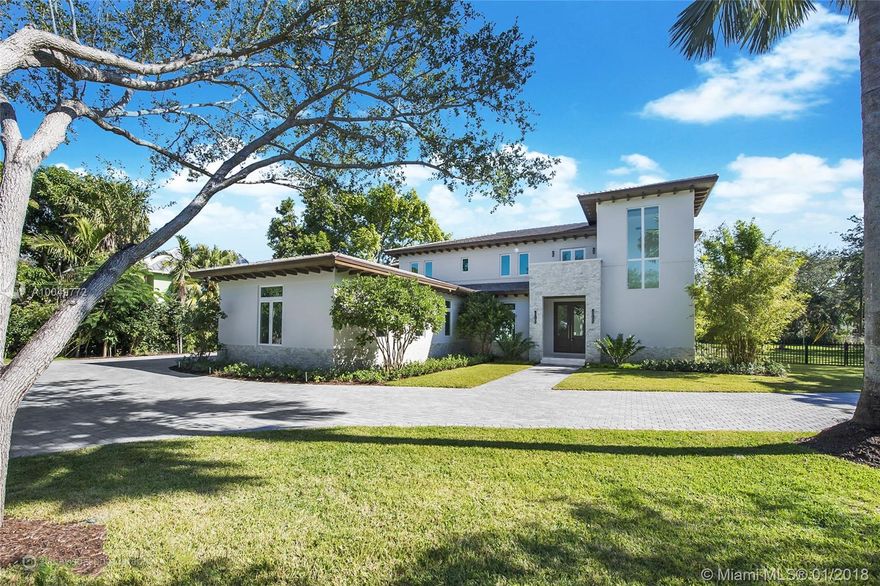 Timeless Contemporary Hollub Homes New Construction in most sought after North Pinecrest location. 5 ensuite bedrooms, mother of pearl guest bath and 4 car garage. Finest finishes including marble mosaics, custom cabinetry, marble floors, large pool, covered terrace and complete summer kitchen. Entertaining inside and out. Bring your pickiest buyers with an eye for excellence. Elevator, Surround Sound, Chefs Kitchen much more. Ready to move in!