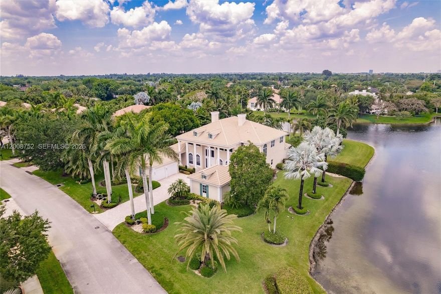 Enjoy wide water views spanning over 180 feet from this premium corner lot on a builder’s acre.  Located in the prestigious boutique, manned-gated community of Stonebrook Estates. Entering the market for the first time, this Colonial-style two-story home offers 6 bedrooms, 5.5 baths, plus an office and a flex space. Features include Grand double vaulted ceilings, a 4-car garage, high-impact windows, a generator, and gas appliances. Community amenities include a clubhouse with a fitness center, media room, party room, playground, and courts for tennis, pickleball, basketball, and volleyball. Owner states home is larger than reflected in tax records.