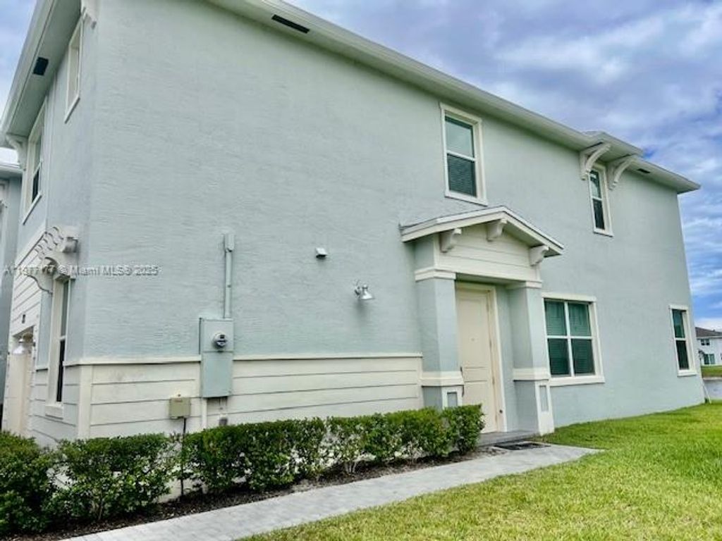 Photo of 871 SE Grovebush Ln, Port St Lucie, FL 34984 (MLS # A11877177)