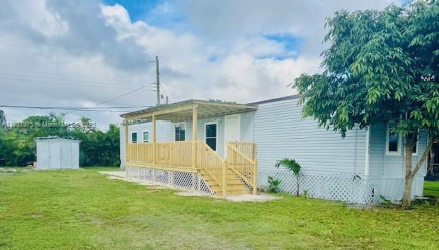 Centrally located in West Palm Beach, just a few blocks from Okeechobee Rd. and Military Trail.
This manufactured, 2-bedroom & 2-bathroom home is fully remodeled, has two brand new covered porches with plenty of room to sit & relax with family & friends. Its interior laundry is equipped with a full-size washer & dryer for your convenience. Private, fenced in yard to park your vehicles, garden or BBQ.