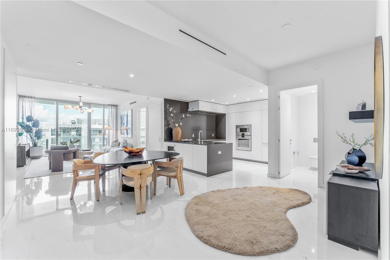 Panoramic Residence 4309 impeccably staged by renowned, New York based IMG at the BRAND NEW Aston Martin Residences in the heart of Miami. An open, split floor plan featuring 2 beds + den, 2.5 baths and volume 10ft ceilings open to a private balcony overlooking sparkling city views of Downtown. Enjoy top-of-the-line finishes including Bulthaup kitchen equipped with Gaggenau appliances, Bertolotto doors, and luxurious primary bath with soaking tub, rain shower and water closet. Residents enjoy exclusive access to 4 levels of private amenities including indoor & outdoor pools, poolside cabanas with jacuzzis, 2 story fitness center with spin, boxing and relaxation studios, men's & women's spa with steam, sauna & jacuzzi, golf lounge & simulator, and more! Experience the next level of luxury