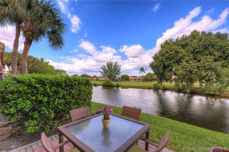 Sweeping water and golf course views from every window in this unit.  Private and secluded location in the back of the complex.  Tastefully updated kitchen and baths make this home perfect for Florida living and entertaining.  Call today for a private tour