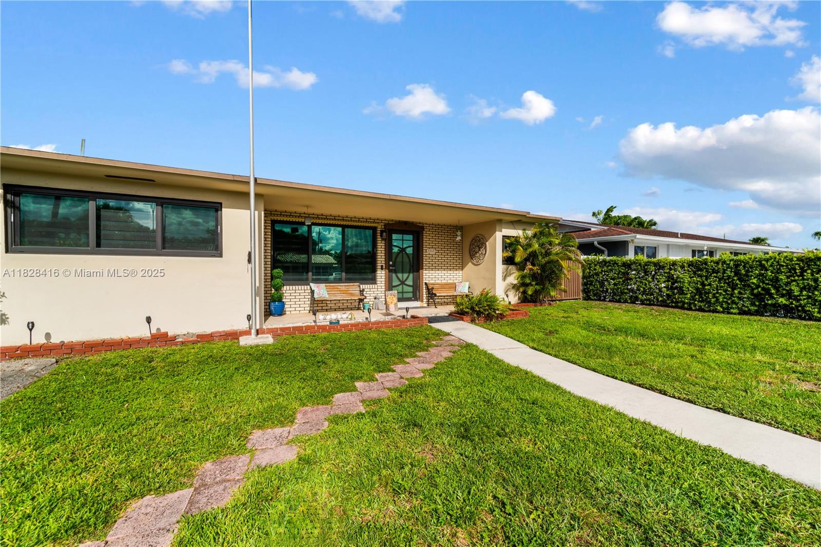 Welcome to your private oasis in the heart of South Florida! This 4/3 single-family home offers impact windows & doors and uniform tile flooring throughout. The split floor plan allows for privacy, while the spacious multi-use room—complete with a full bathroom—offers flexible use as an IN-LAW unit, a guest house, or generous storage space that opens directly to the covered patio and sparkling pool, perfect for entertaining. Enjoy thoughtful upgrades including shades, ceiling fans, chandelier, and stainless-steel appliances. The property also features a shed for extra storage and a fenced, expansive backyard with no HOA, centrally located with quick access to major highways; this gem bridges Miami-Dade and Broward County, making commuting more convenient.