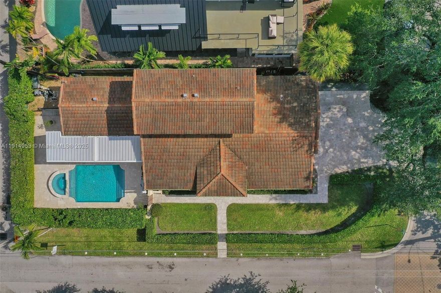 Remodeled corner lot 4/3 three blocks off Las Olas in Colee Hammock.Newer roof.Impact windows & doors.2 side loaded CG & expanded driveway.Custom gourmet kitchen w/50+ cabinets.Dining room w/large buffet/coffee station & wine cooler.Amazing resort style pool/patio/yard area w/hurricane grade Pergola.Roof opens & closes for comfort year around.Cost efficient gas heated pool w/newer pool finish&deck.Downstairs master suite w/remodeled bath w/soaking tub,zero step in shower,double vanity.Split plan w/addt'l bedroom down & remodeled bath w/walk in shower.Upstairs w/2 bedrooms (one w/pocket doors to hallway for use as loft) each w/walk in closet & remodeled bath.Other:Dbl door entry;Bahama shutters & silhouette blinds;newer AC motor & compressor;termite treatment;newer pool pump & washer/dryer