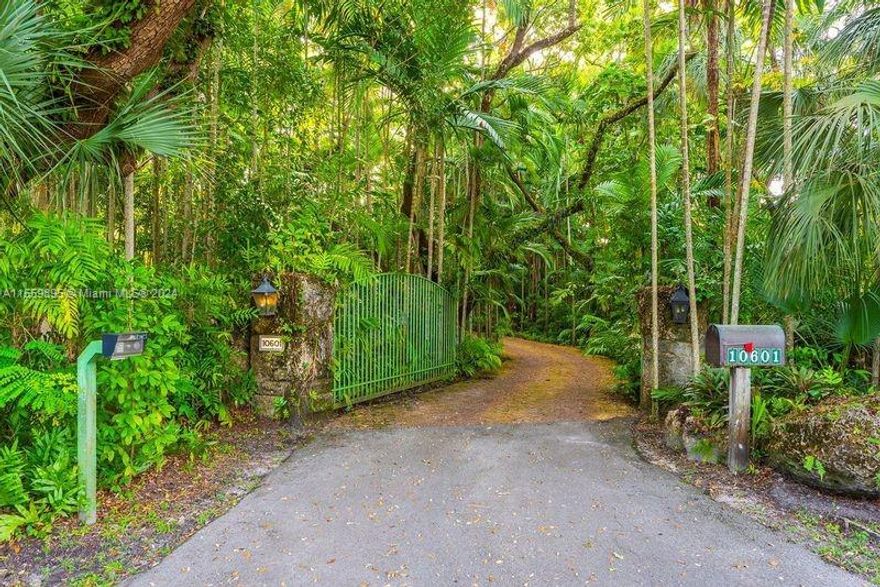 Indulge in the enchantment of a bygone era as you step onto this captivating property, where old-world Spanish charm converges with modern sophistication. Crafted by Hidalgo Construction, the stucco façade, ceramic tiles, Cupula towers, antique wooden doors and bronze details transport you to the heart of Spain. This 3 bedroom architectural marvel, nestled within the exclusive Snapper Creek Lakes gated community radiates timeless elegance. The estate spans a generous 61,835 square foot lot, cocooned by majestic Oak, Banyan & Palm trees. Immerse yourself in the serenity of the surroundings, with breathtaking views of the tranquil Elbow Lake. Impeccable craftsmanship and meticulous detailing adorn every corner of this villa creating an ambiance of unparalleled sophistication.