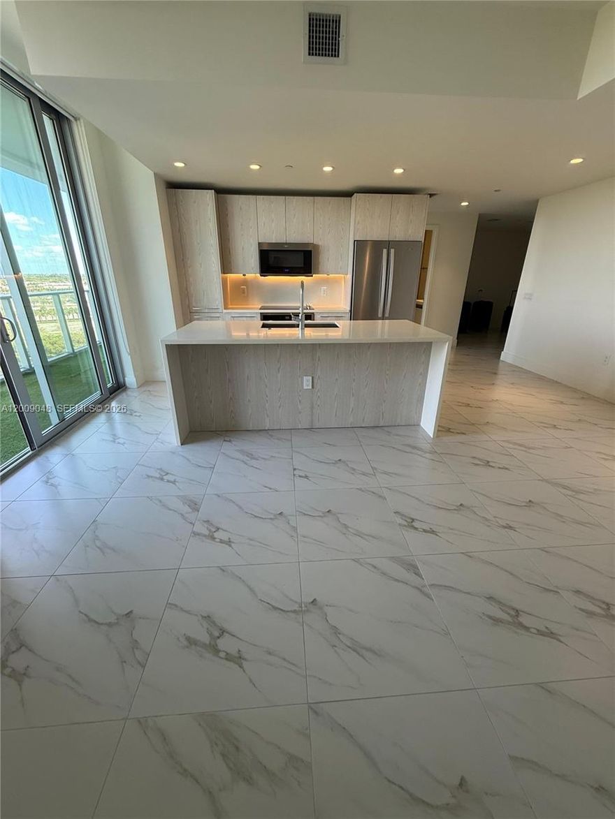 NEW listing for sale! Unique opportunity!!! Beautiful kitchen and flooring design in a brand new high-end building. This 3 bed-3 baths unit with Den with best price on the building. Custom built-in closets and blinds. Located in the beautiful complex in Metropica, next to Sawgrass Mills, this 1,696SF condo has high-end features such including brand new flooring throughout, new Appliances, quartz counters in the kitchen, and all 3 bathrooms, recently built closets and blinds in the bedrooms and living spaces. This unit has a huge spacious balcony features views from each room, full impact glass, washer/dryer in unit, pet friendly. Metropica offers high-end amenities, kids room, 24 hr security, valet services. Unit has one parking space and more parking is available in the building.