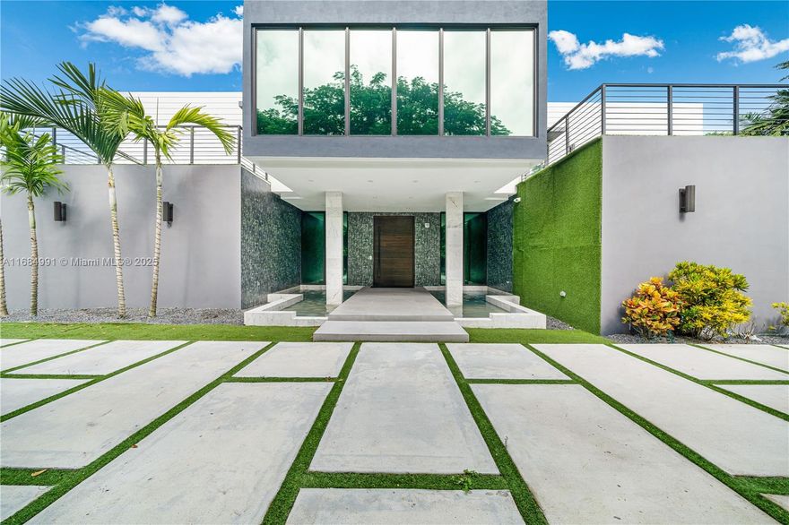 Motivated seller – great opportunity for buyers! Presenting a stunning, modern masterpiece by ECO Modern Custom Homes. This exquisite 2-story residence is nestled in a welcoming Pinecrest neighborhood. Step through a solid wood pivot door into a spacious, light-filled living area with soaring 20-foot ceilings and premium Castellon porcelain flooring from Spain. With careful attention to detail, this 8,337 total s/f home offers 7 bedrooms, 7.5 baths, dual car garages, a media room, wine cellar, Pedini kitchen, safe room, and office. Set on an expansive 30,094 s/f lot, the outdoor space is perfect for entertaining, featuring a pool and lush landscaping around the property. A fully equipped smart home, it provides convenient control through a smartphone app.