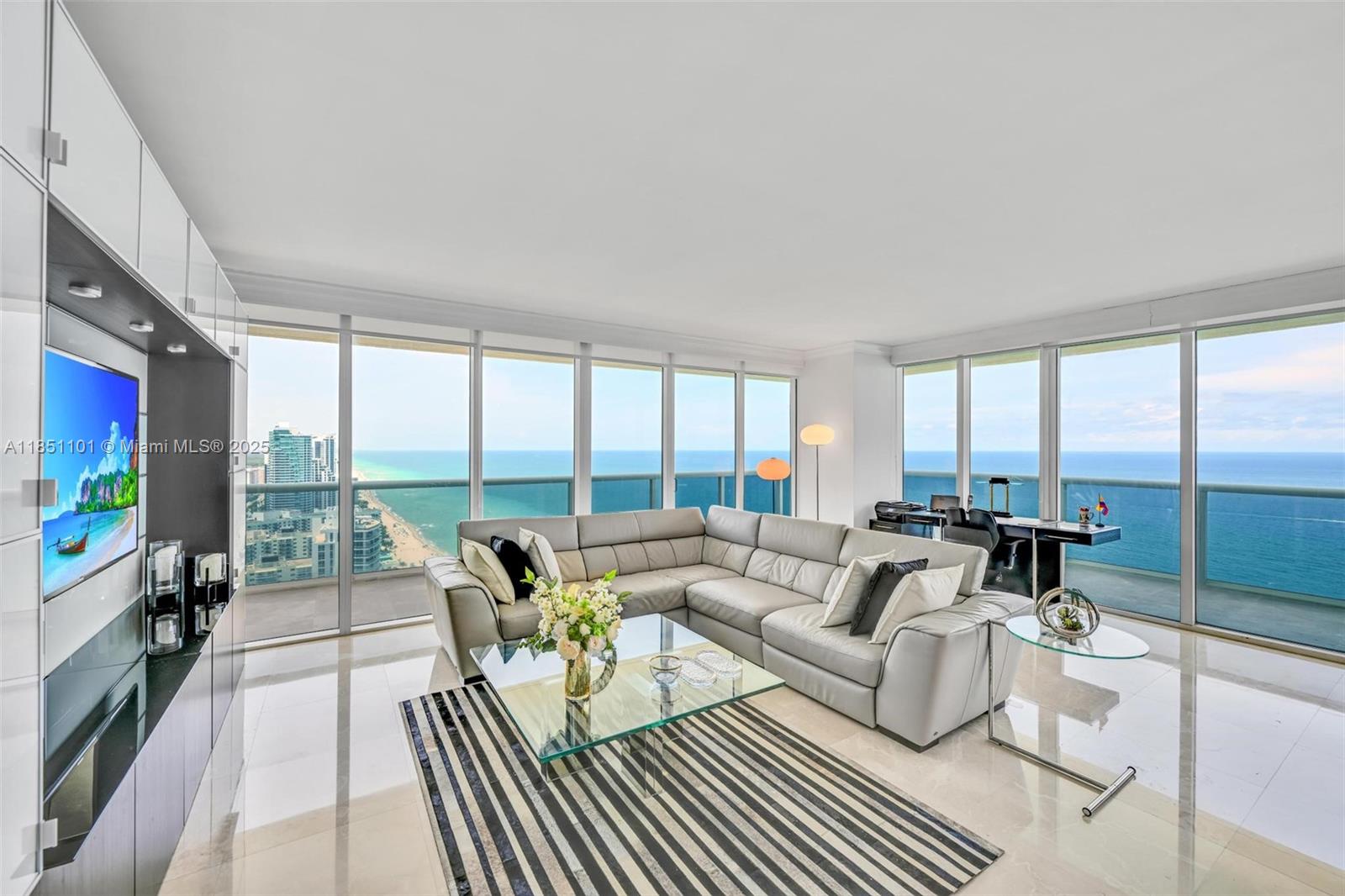 Stunning northeast corner unit on the 38th floor with panoramic views of the ocean, Intracoastal, and city skyline. This 3-bed, 3-bath residence offers 2,065 sq. ft. of interior space plus a 565 sq. ft. wraparound balcony perfect for enjoying sunrises and sunsets. Features include marble floors throughout, custom California closets, and a European style kitchen with granite countertops and KitchenAid appliances. The spacious primary suite includes a Jacuzzi tub and separate glass enclosed shower. Enjoy resort style living with a 2 story lobby, concierge service, 24-hour security and valet, five heated pools, and oceanfront spa and fitness center. Includes one assigned parking space and complimentary valet. 30 day minimum rentals allowed, up to 12 times per year. Easy to show!