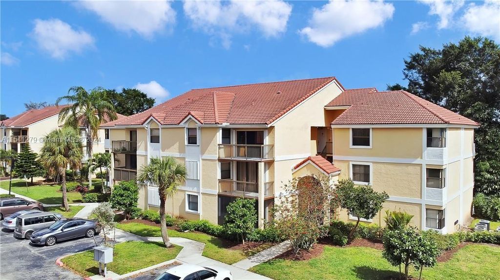 Photo of 5761 Riverside Dr #205B4, Coral Springs, FL 33067 (MLS # A11541279)