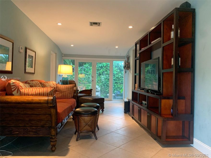 In the HEART of Biscayne Park! Updated and Lovely 2 bedroom & 2 bathroom single family home! Comfortable and spacious living spaces with vaulted ceilings in the entry and family room.  Polished hardwood floors.  There is a full one car garage....great for storage and parking a car ! Laundry area in garage as well.  Beautiful corner lot on a tree-lined street.  Quiet location...you will love living here!  Small yard in the back.  NO fenced yard. 2 Adults max.