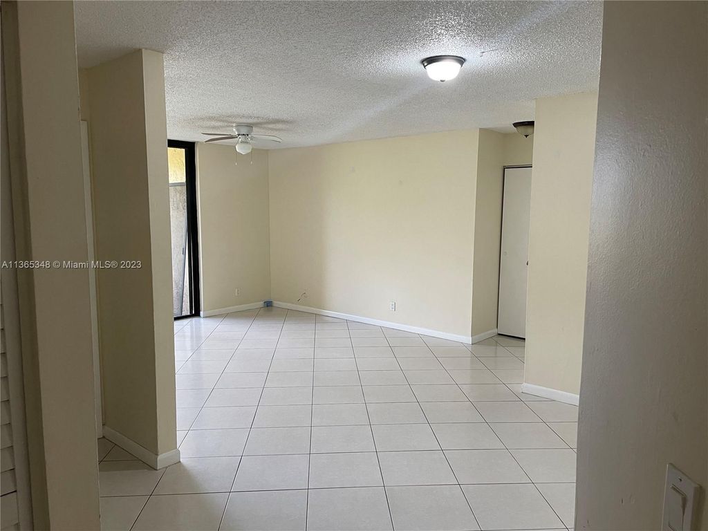 Photo of 5661 Riverside Dr #101B7, Coral Springs, FL 33067 (MLS # A11365348)
