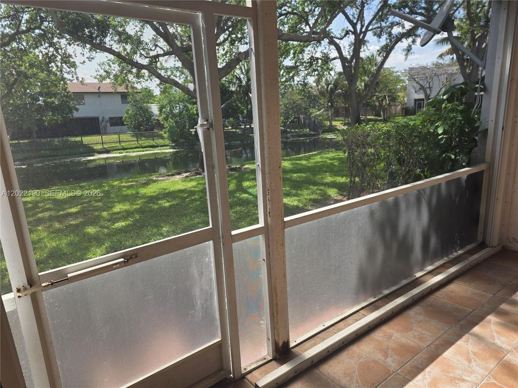 Photo of 9521 NW 42nd St #9521, Sunrise, FL 33351 (MLS # A12022190)