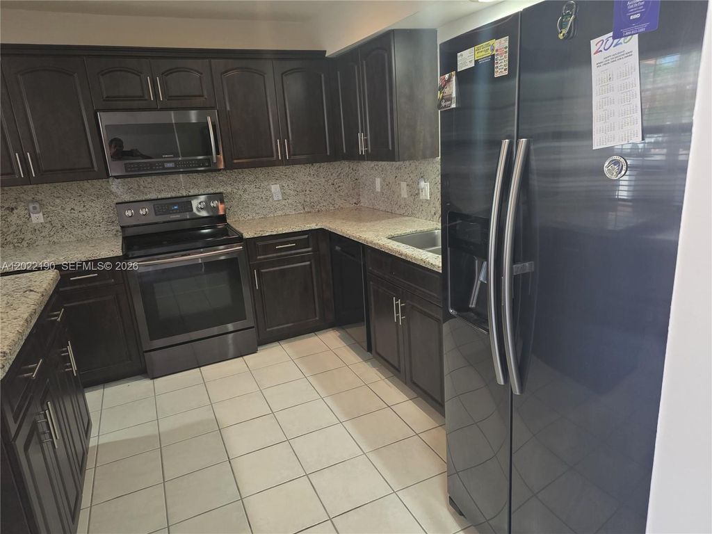 Photo of 9521 NW 42nd St #9521, Sunrise, FL 33351 (MLS # A12022190)