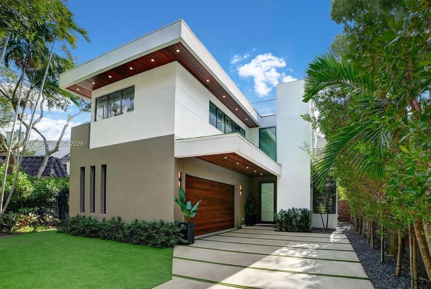 Unique opportunity to own this stunning, modern residence in the highly desirable and ultra-private North Grove section of Coconut Grove—one of Miami's most prestigious and serene neighborhoods.

New Construction Nestled on a secluded cul-de-sac, this exceptional home offers unparalleled privacy and tranquility while enjoying prime proximity to the best of Coconut Grove living. With soaring 12-foot ceilings and a convenient elevator for effortless multi-level access, the residence features 5 spacious bedrooms and 4 bathrooms, including a downstairs guest/in-law suite with its own cabana bath for ultimate flexibility and comfort.
The gourmet kitchen is an epicurean's dream, boasting a massive central cooking island, top-tier Sub-Zero, Wolf, and Miele appliances, and seamless flow for entertaining or everyday luxury. Luxurious details abound: 10-foot impact windows flooding the home with natural light, rich wood floors throughout, integrated security cameras, and sophisticated custom lighting.

Step outside to your private oasis—a stunning saltwater pool illuminated by vibrant color LED lights, perfect for year-round relaxation in Miami's tropical climate. Ascend to the impressive 868 sq ft rooftop terrace, an entertainer's paradise with breathtaking views and endless potential for outdoor lounging, dining, or stargazing.

A 2-car attached garage and thoughtful modern finishes that elevate everyday living 
Alumatech Gourmet exterior Kitchen with Bull Appliances.