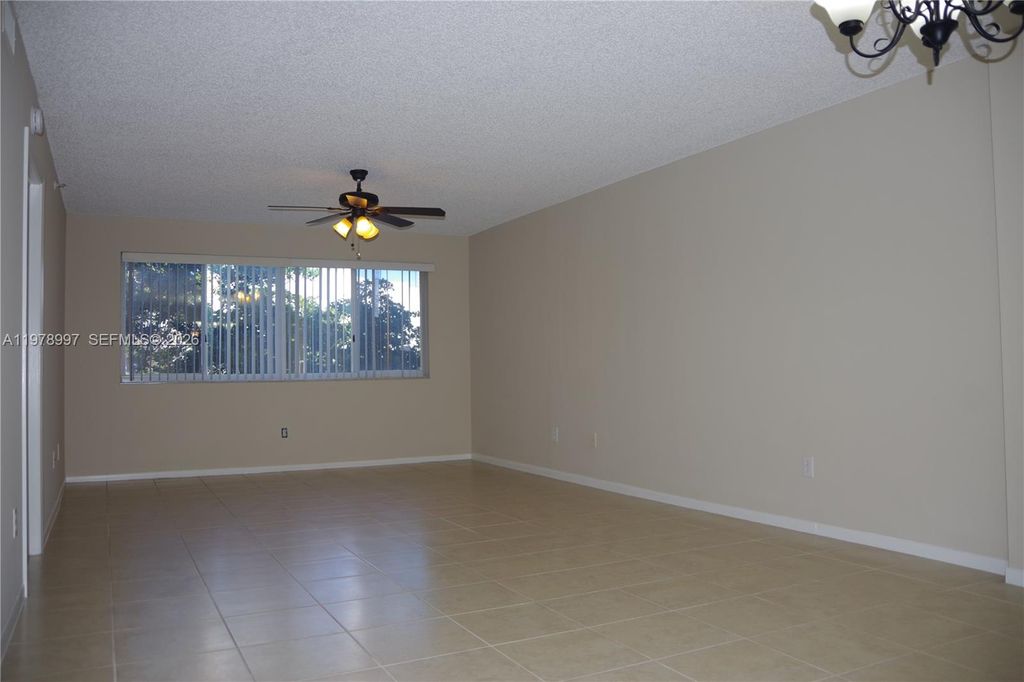 Photo of 9511 Weldon Cir #G315, Tamarac, FL 33321 (MLS # A11978997)