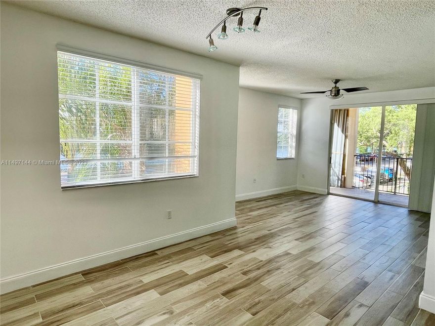 Want to feel like you're living at a luxury resort? Well, welcome home! This beautiful one bedroom one bathroom remodeled unit located at The Residences of Miramar is turn key and ready for you to call it home. This corner unit features plenty of windows for natural light that shines on the wood-look tile throughout the entire space. Open concept kitchen that's great for entertaining. This resort style gym has everything you need and a racquetball court. After your workout, relax at the oasis style pool and jacuzzi. Complex features a clubhouse, business center, playgrounds and tennis court. Community is fully gated/security patrolled. Customs closets, Tankless Water Heater 2023, A/C 2020