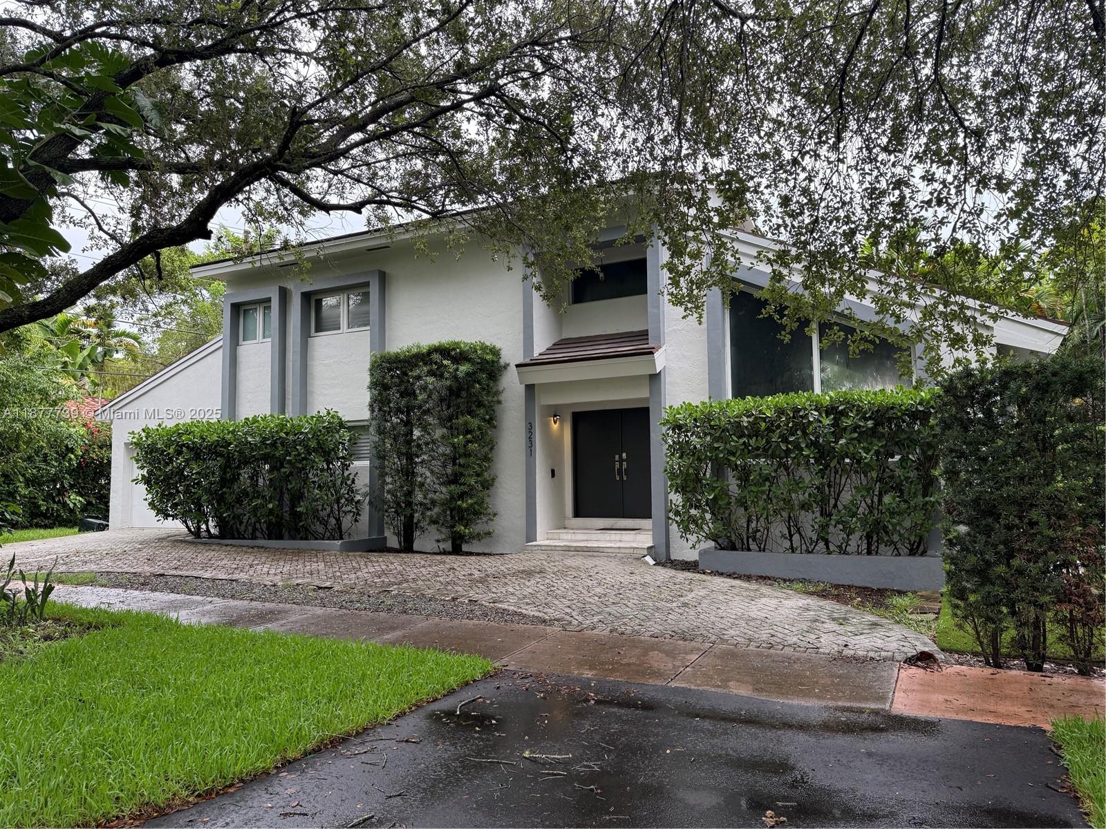 Location.Location!!! A beautifully renovated two-story villa seamlessly blending modern style with timeless charm. Soaring Cathedral ceilings with exposed wood beams create a warm yet contemporary atmosphere Updated within the past two year, this residence combine classic appeal with modern finishes, brightened by impact-rated windows and doors throughout. The open kitchen that flows into the family room, perfect for daily living and entertaining. Fleeting contemporary stairs with glass railing lead you to the second floor, where you'll find two spacious bedroom and two full bath. The primary suite features a spa like bath with dual sinks and a sensible walk-in closet. On the first floor, a private one-bedroom suite includes a full bath and closet, ideal for guests or extended family.