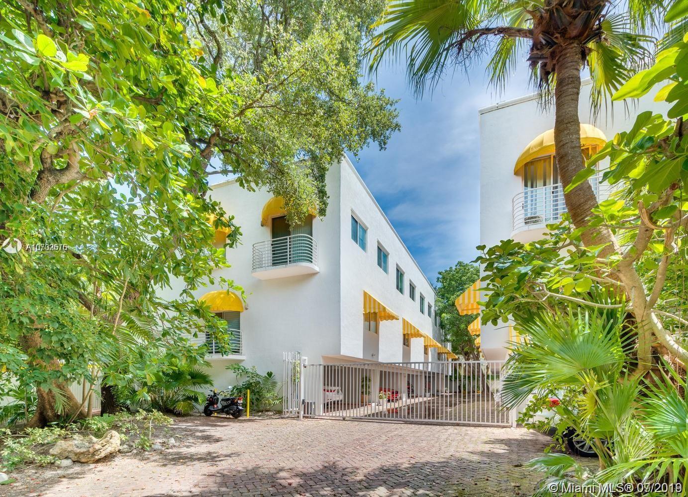 Fantastic contemporary two story townhome in a gated complex in the heart of Coconut Grove. This is a 2 bedroom 2 1/2 bath plus a media/bonus room with Travertine and berber carpet floors, soaring ceiling in living room with lots of light. Unit offers a large patio off the living room and balcony off the master.Walking distance to Coconut Grove. Pet friendly and easy to show.