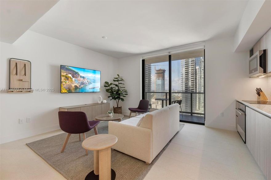 **Turnkey Luxury Investment – Fully Furnished 2BD/2BA with Partial Bay Views**Discover the perfect blend of luxury, convenience, and investment potential in this high-floor 2-bedroom, 2-bathroom apartment with partial views of Biscayne Bay. Fully furnished with high-end finishes, this unit is enrolled in a rental program, offering steady income for the rest of the year—a prime opportunity for investors. Key features include a stylish layout, and exceptional amenities: pool, gym, spa, restaurants, event hall, kids’ playroom, and more. Located just steps from FX Stadium, top dining, and shopping, and surrounded by iconic venues like Miami World Center, Frost Museum of Science, Miami Airlines Arena, and the Adrienne Arsht Center for Performing Arts. Virtual tour available!!!