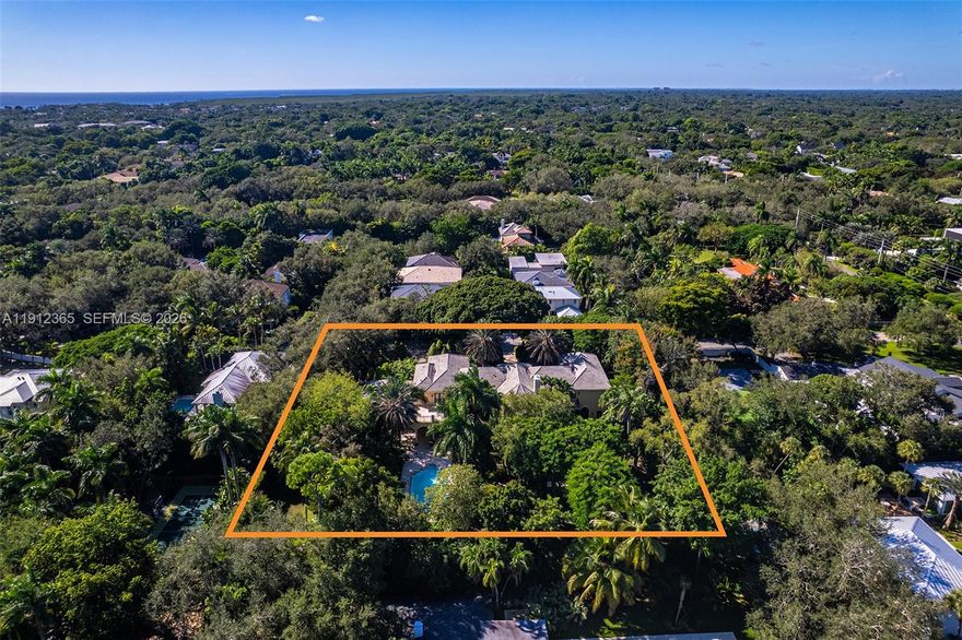 Legacy Estate nestled on over an acre of breathtaking landscape in prime Ponce-Davis. This majestic 8,485 Sq.Ft residence features grand gated entrances beneath towering palms, leading to great room with soaring ceilings. Boasting 7 bedrooms all with ensuite baths, 2 half baths, & an ideal floor-plan with 5 bedrooms upstairs & massive terraces overlooking the pool & gardens. Designed for comfort & entertaining, the home also offers an office, movie theatre, & an open eat-in gas kitchen with custom bar. Outdoors, the backyard is truly exceptional, with a gorgeous heated pool, expansive patio, summer kitchen, fountain, & lush landscaping highlighted by multiple specimen trees. 3-car garage with electric car charging. Near top-rated private schools: Gulliver, Carrollton & Ransom Everglades.