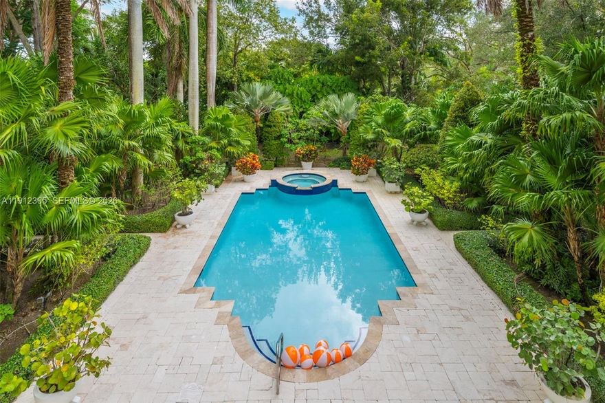 Legacy Estate nestled on over an acre of breathtaking landscape in prime Ponce-Davis. This majestic 8,485 Sq.Ft residence features grand gated entrances beneath towering palms, leading to great room with soaring ceilings. Boasting 7 bedrooms all with ensuite baths, 2 half baths, & an ideal floor-plan with 5 bedrooms upstairs & massive terraces overlooking the pool & gardens. Designed for comfort & entertaining, the home also offers an office, movie theatre, & an open eat-in gas kitchen with custom bar. Outdoors, the backyard is truly exceptional, with a gorgeous heated pool, expansive patio, summer kitchen, fountain, & lush landscaping highlighted by multiple specimen trees. 3-car garage with electric car charging. Near top-rated private schools: Gulliver, Carrollton & Ransom Everglades.