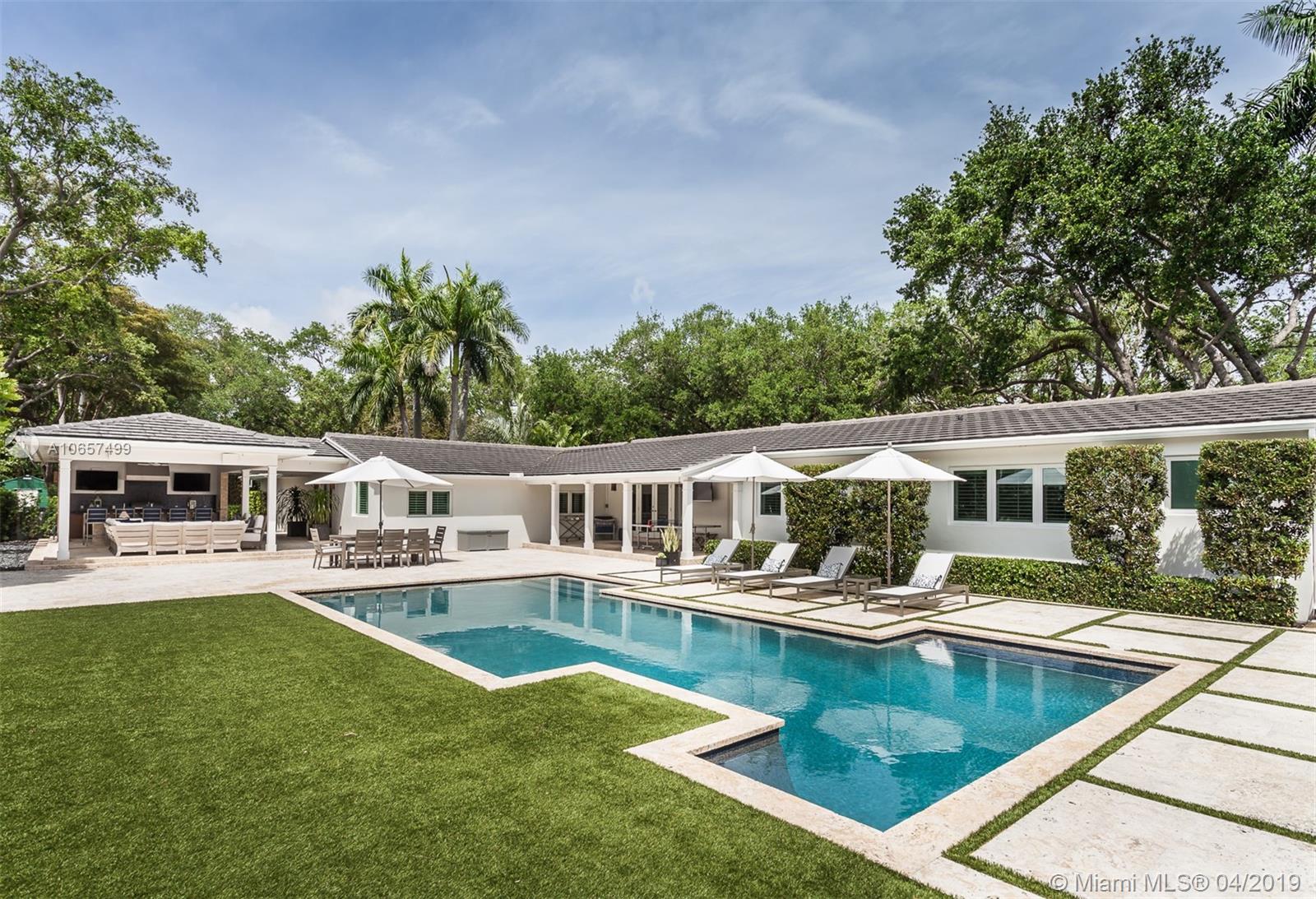This residence&#x2019;s outdoor area offers multiple entertainment spaces, with brand new pool, patio and summer kitchen with BBQ grill, sitting area, cabana bath, outdoor shower, plus a putting green and basketball half court. Impeccable living spaces, including fantastic kitchen remodeled in 2016, with huge cooking island, custom cabinets, wolf gas range, sub-zero refrigerator, and butler&#x2019;s pantry. Gorgeous master suite features his and her walk-in closets, master bathroom with separate tub and rain shower. Perfectly situated in the prestigious and tranquil neighborhood of Ponce Davis, this home also comes with smart-house technology, full house generator, and all new roof, impact windows and doors.