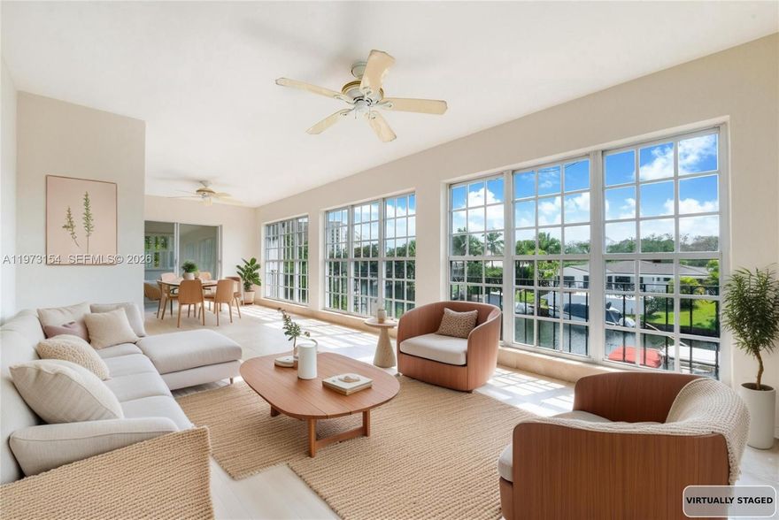 First time ever offered. A unique waterfront offering in Coral Gables now presented as 2 separate condominium residences. Unit B, upstairs residence, enjoys elevated perspectives of the waterway & natural light from walls of windows capturing serene views throughout the home. A bright sunroom provides the perfect place to relax while overlooking the water. This residence includes 40 FT of dockage (half of the property’s 80 FT boat dock) accessed via a private side stairwell shared by both units. The spacious floor plan includes an ample living room, separate dining room, &  large eat-in kitchen w/granite counters, stainless appliances & counter seating that opens to the family room creating inviting living & entertaining spaces. Neutral finishes & updates provide a move-in ready environment. The residence features 2 large bedroom suites w/2 private baths plus a powder room, porcelain tile floors throughout, plantation shutters & generous closet space. Additional highlights: an indoor laundry room w/full-size washer/dryer & space for an additional refrigerator/freezer, an exterior walk-in storage closet, & three exterior parking spaces. A charming walled courtyard entry welcomes you to this meticulously maintained property owned by one family. New roof March 2025. Unit B is offered at $3M & includes 40 FT of dockage. Unit A (MLS #A11973153) is also available. Both units may be purchased together for $5.8M creating an exceptional waterfront compound w/ 80 FT of dockage.