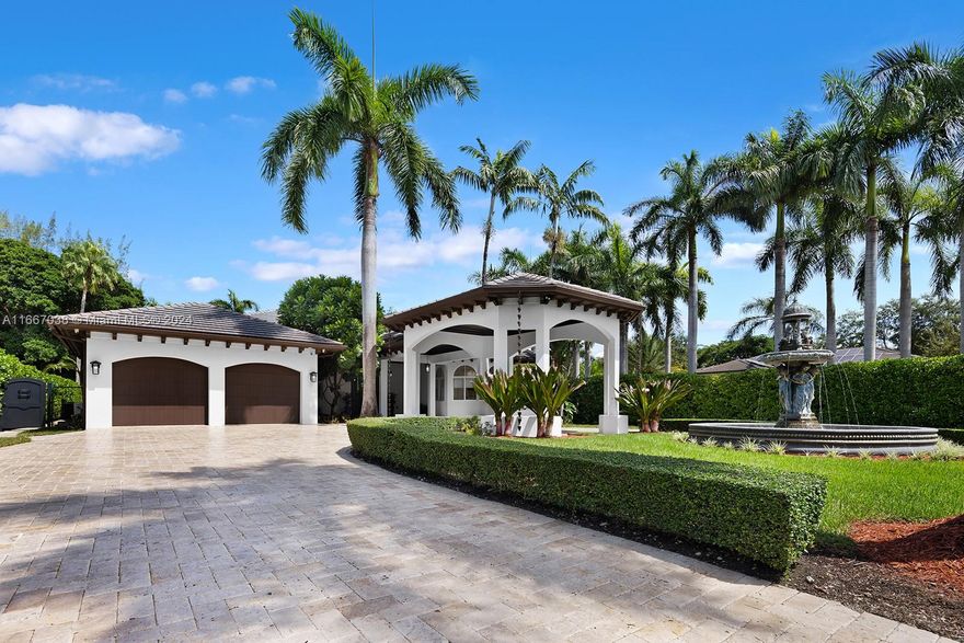 Nestled in North Pinecrest, this privately gated estate epitomizes timeless luxury, spanning over a 30000 sqft lot. Upon entering, you’re welcomed by 16-ft coffered ceilings, elegant 8-ft solid doors, & exquisite marble floors, creating an inviting ambiance. The gourmet kitchen, featuring Viking appliances, custom cabinetry, & a wine fridge, is centered around a spacious island perfect for gatherings. Each oversized bedroom has custom walk-in closets, while the master suite offers a serene retreat with his & hers closets. Step outside to discover your outdoor oasis, complete with a beach-entry pool, shaded custom pergola, & summer kitchen, all surrounded by lush, meticulously landscaped grounds. With ample space on this builders acre, you could easily add a pickleball court for recreation.