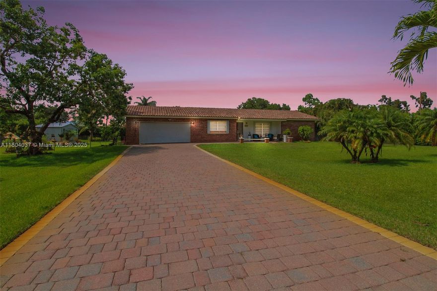Stunner one-acre lot in Davie offers plenty of space to expand this cozy 2 bedrooms 2 bathrooms single family with screened pool. The one-story home has split floor plan, master bedroom with walking closet, hurricane impact windows, accordion shutters and impact doors. The screened backyard area offers a separate covered area so you can enjoy the pool without getting sunburned. The oversized lot features lush tropical landscaping, with fruit trees including coconut and mango trees. Storage Shed 24x12 offers extra storage space/workshop. 2 Car garage and super long driveway fit up to 6 cars and additional space to park your boat, RV, or trailer. No HOA! A hardwired generator for the whole home. New A/C, pool equipment and water softener.  Close to I-595, restaurants, and shopping